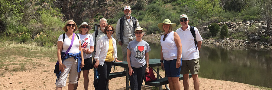 Active seniors pose for a photo during a trail walk