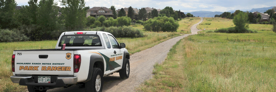 A park ranger truck patrols a trail in Highlands Ranch open space.