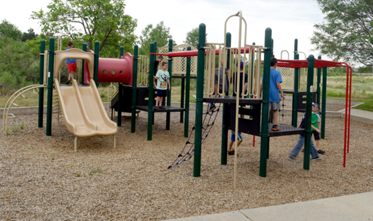 Marcy Park playground equipment with kids climbing and playing.