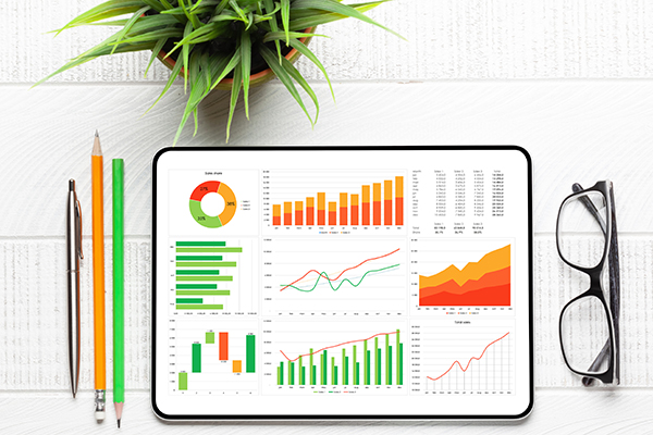 A series of charts and graphs is displayed on a tablet computer.