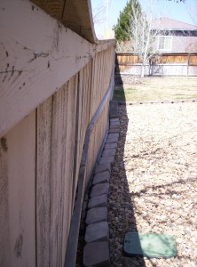 Landscape materials should not be placed adjacent to a fence.