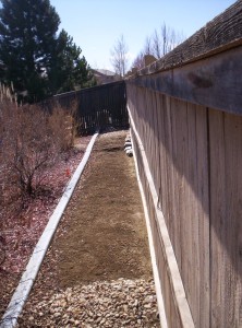 This is a good example of keeping a 12-inch buffer between your landscape and the fence.